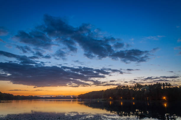 istock Amazing sunset at the lake with dynamic sky in summer 860480826