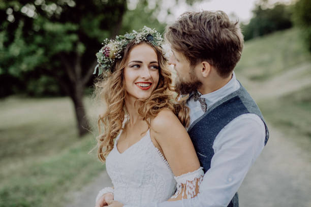 istock Beautiful bride and groom in green nature. 860491230