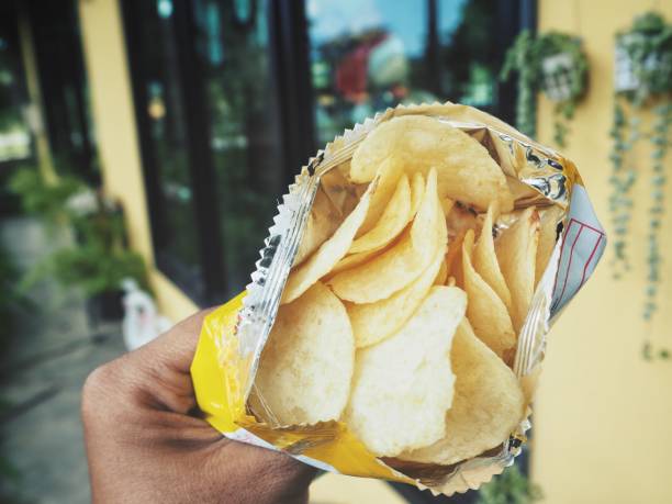 istock Selfie of hand with potato chips 860492684