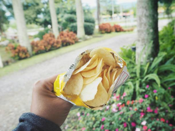 istock Selfie of hand with potato chips 860494874