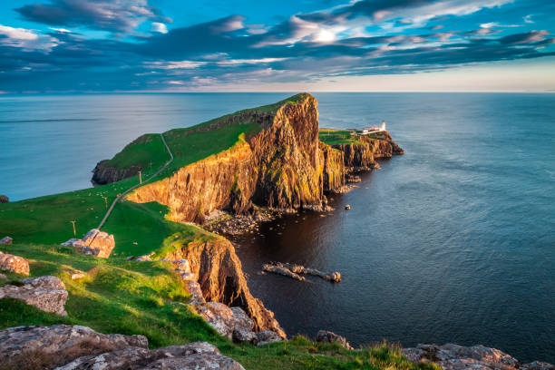 istock Sunset at the Neist point lighthouse, Scotland, UK 860498790