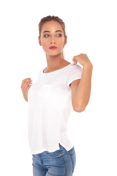 istock young casual woman posing with hands on shoulders 860498806