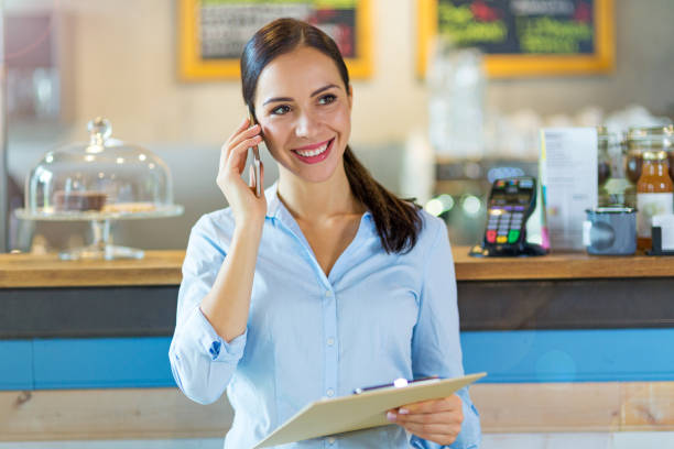 istock Young woman working at cafe 860499356