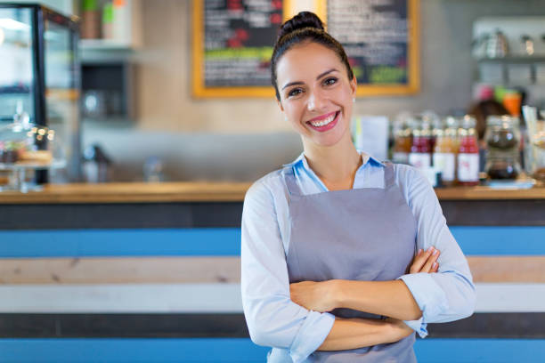 istock Young woman working at cafe 860499620