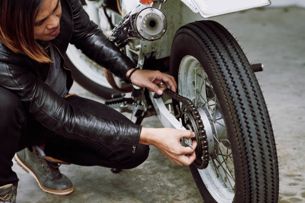 istock Repairing Motorcycle Outdoors 860502750