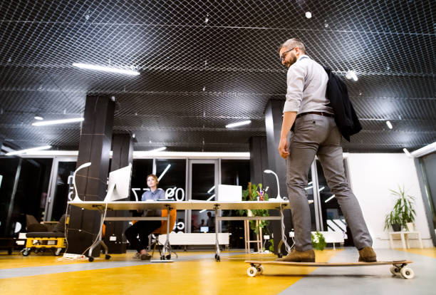 istock Businesspeople in the office at night working late. 860502922