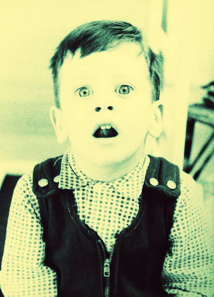 istock Vintage blue toned surprised kid 860503192