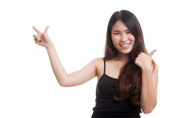 istock Young Asian woman point and thumbs up. 860503386