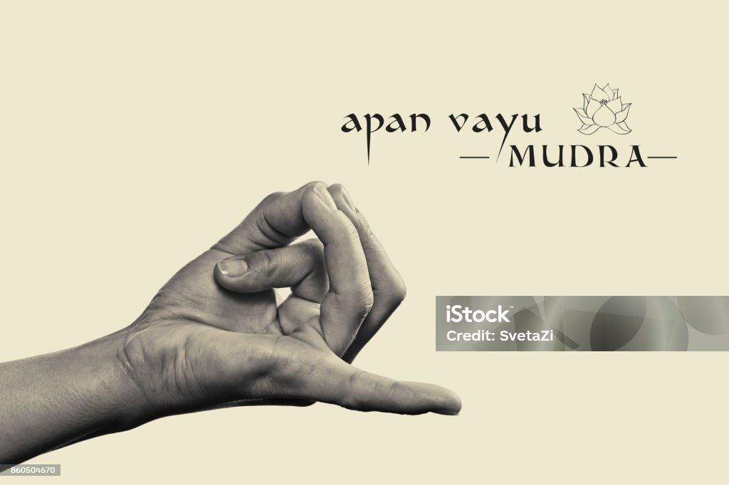 Apan vayu mudra black and white. Apan vayu mudra. Yogic hand gesture. Isolated on toned background black and white. Mudra Stock Photo
