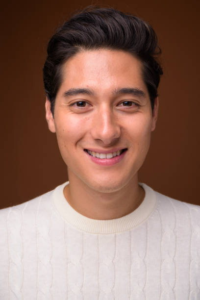 istock Studio shot of young multi-ethnic handsome man wearing white sweater against colored background 860504860