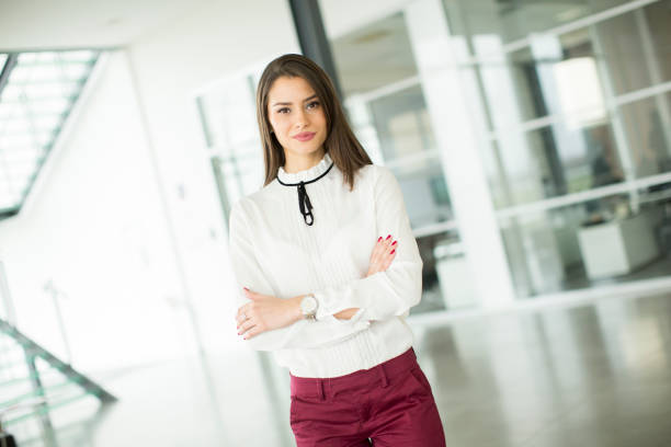 istock Young businesswoman standing in modern office 860507558