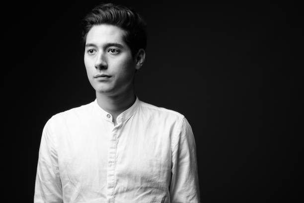 istock Studio shot of young multi-ethnic handsome man against black background 860512000