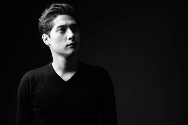 istock Studio shot of young multi-ethnic handsome man wearing black sweater against black background 860512150
