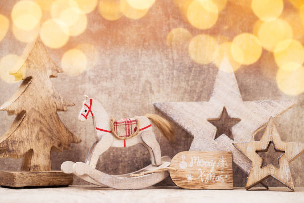 istock Christmas tree decorations on a wooden background. With bokeh ornaments. 860512672