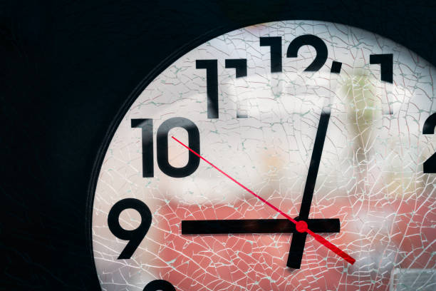 istock Realistic classic dark and white round wall clock with broken glass texture , black background. 860515608