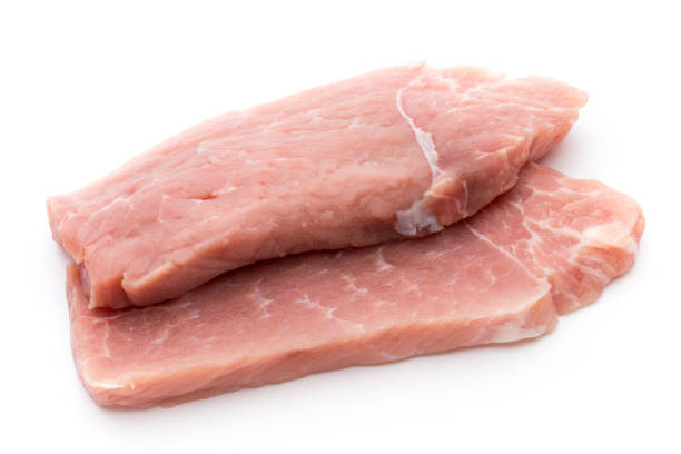 istock Fresh pork fillet with basil on a white background. 860515894