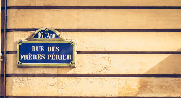istock blue parisian street sign on a stone wall 860523172