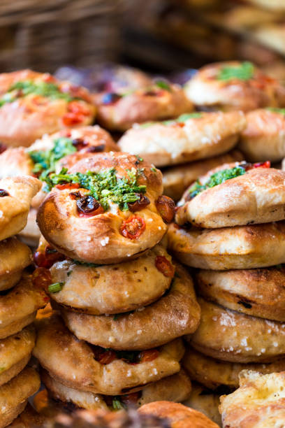 istock Stack of freshly baked artisan breads piled on top of each other 860524422