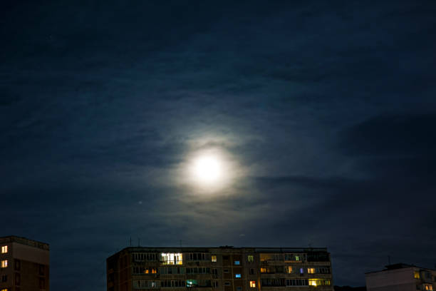 istock the big bright moon hanging over the city, 860525810