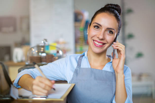 istock Young woman working at cafe 860528252