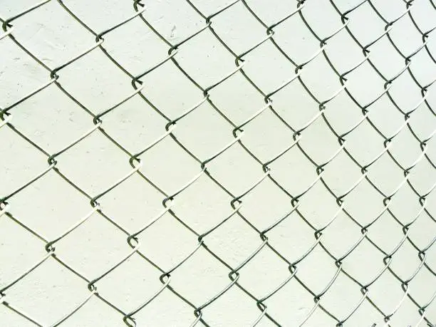 The wire mesh fence pattern and texture isolate on white background.