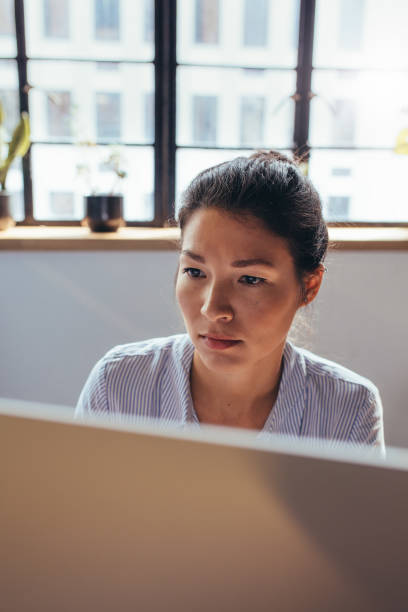 istock Businesswoman working on computer at her office 860529520