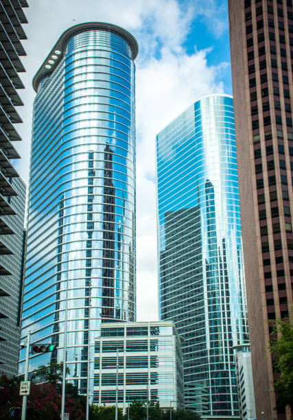 istock Tallest modern skyscraper downtown Houston Texas on a nice sunny day vertical mirrored 860532336