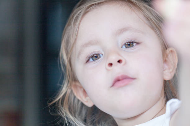 istock Young girl outside looking at the camera 860532652
