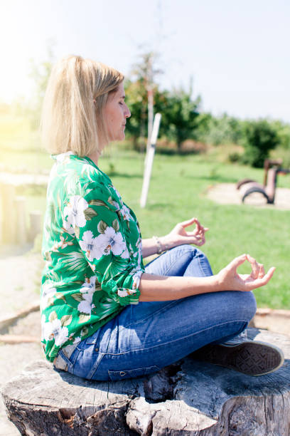 istock Happy, young woman is doing yoga 860533198