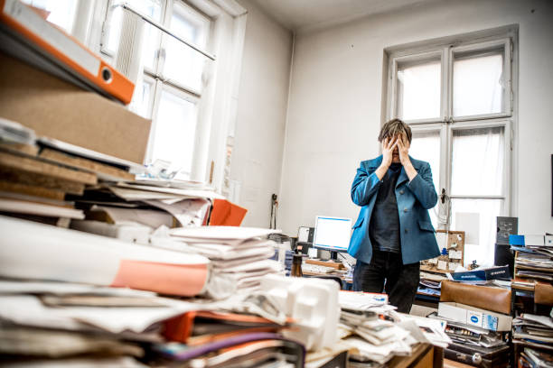 istock Discouraged Entrepreneur In His Overload Office 860536702
