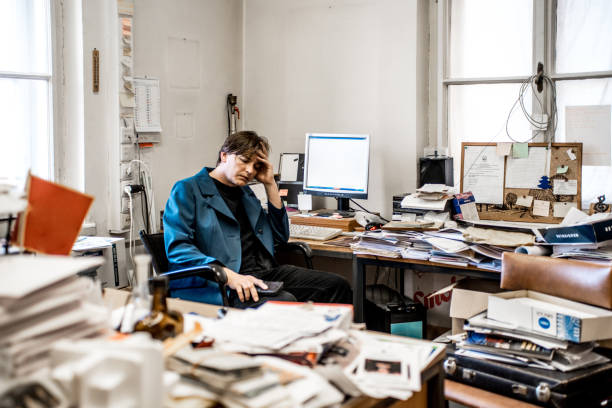 istock Discouraged Entrepreneur In His Overload Office 860536718