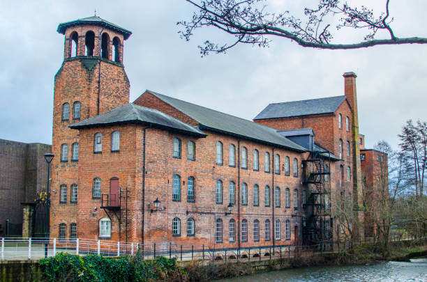 Derby Silk Mill Old industrial building - a historic former silk mill - in Derbyshire, England watermill stock pictures, royalty-free photos & images