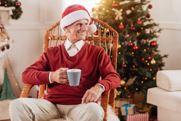 istock Attractive elderly man holding favorite cup 860545182