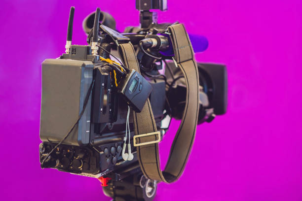 istock TV NEWS studio with camera and lights 860548944