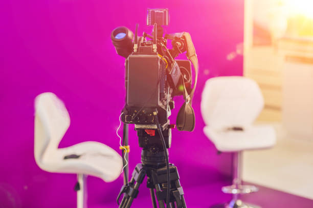 istock TV NEWS studio with camera and lights 860548984