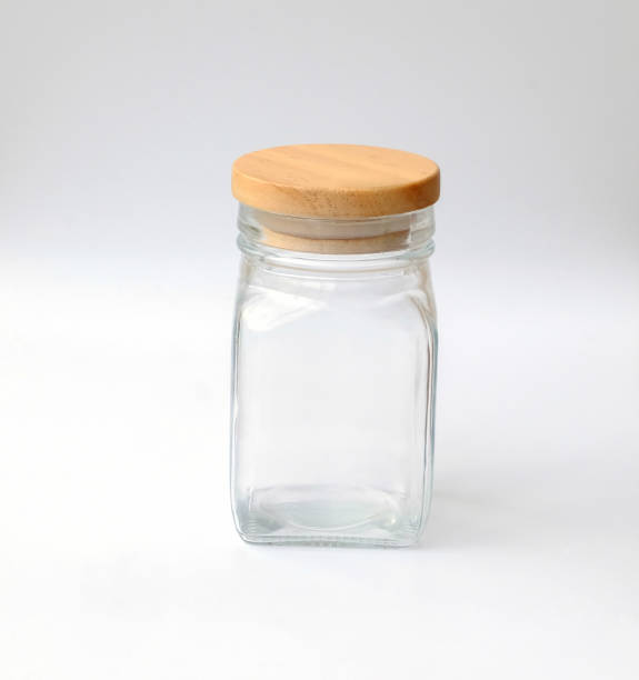 istock Jar with bottle cap made of wood on white background 860553036