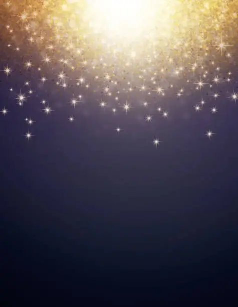 Golden light, glitters and stars falling on a black background