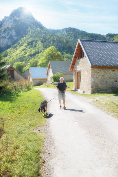 istock Active senior and dog in French mountains 860556964
