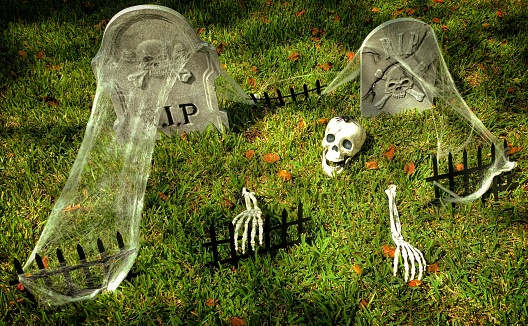 Halloween Decorations of a Skeleton with a Spider on Its Head Climbing Out of a Grave