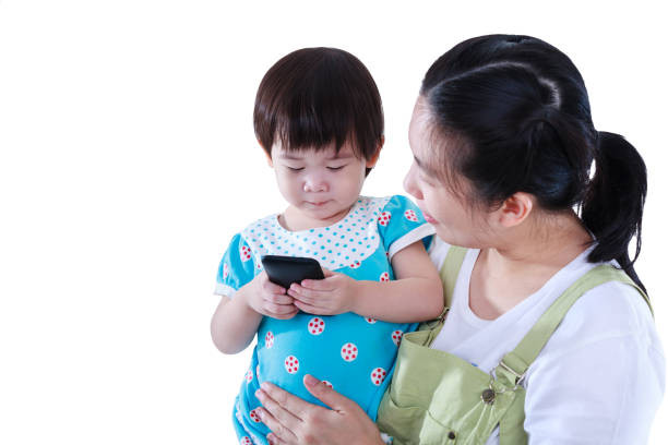 istock Mother with her daughter. Girl using electronic gadget. Isolated on white background. 860565808