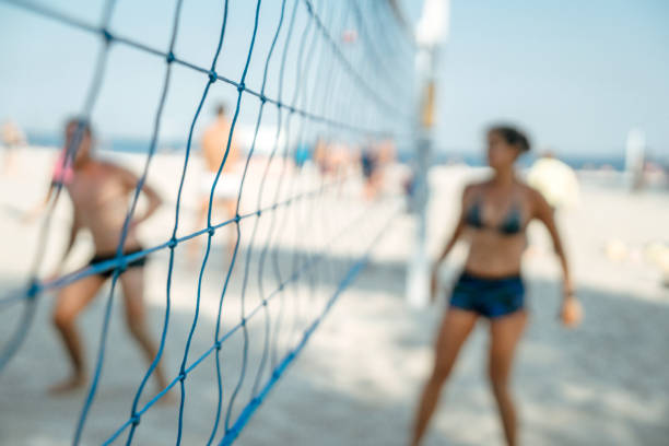 Beach Volleyball Net with Friends in the background, small focus line