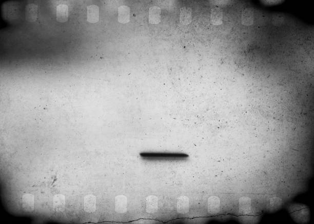 istock Grunge scratched dirty film strip background with blurred effect. 860568012