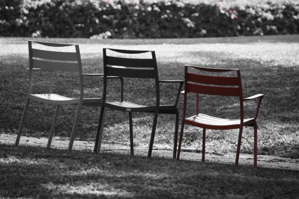 istock Red chair in the garden 860571160