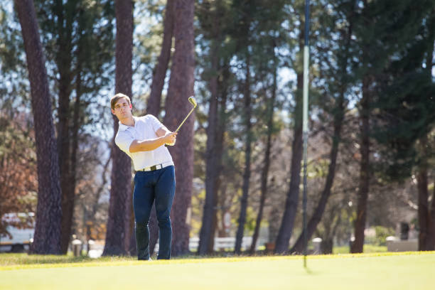 istock Golfer playing a chip shot on a golf course in South Africa 860574602