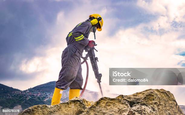 Worker On Top Of A Rock Stock Photo - Download Image Now - Mining - Natural Resources, Miner, Drill