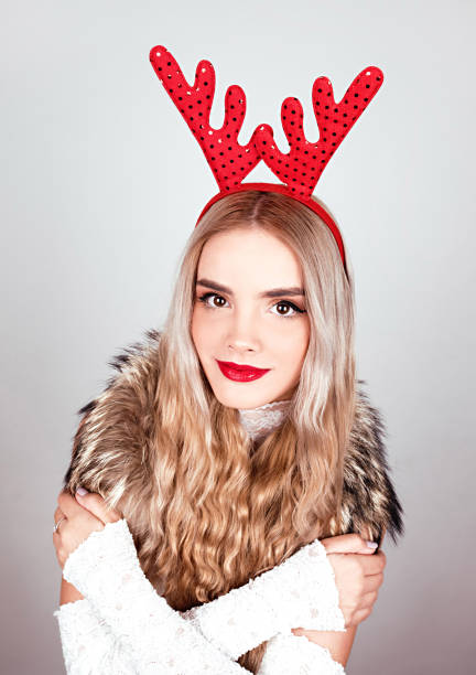 istock Young woman with deer horns 860581972