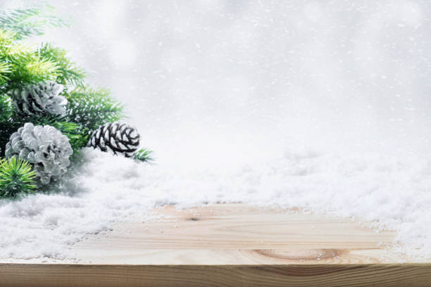 istock Fir tree,pine branch,snow on wooden table. 860582706