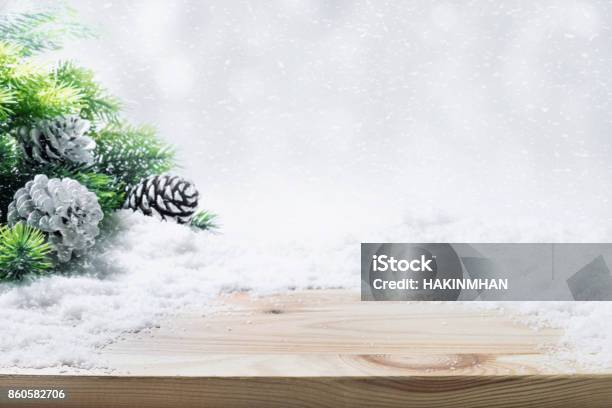 Fir Tree Pine Branch Snow On Wooden Table Stock Photo - Download Image Now - Table, Vacations, Backgrounds