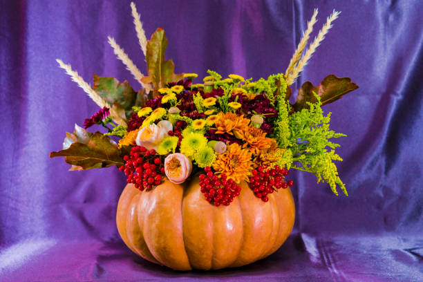 istock Bouquet for Halloween in a vase from pumpkin. 860585408