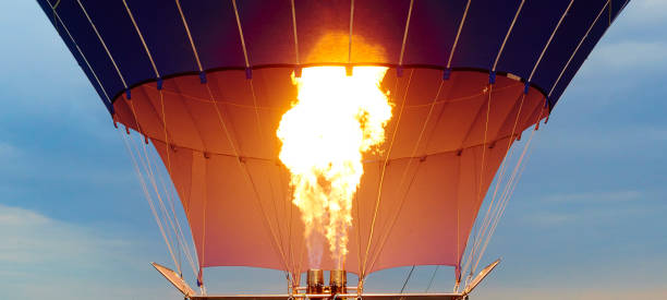 istock hot air balloon as it is inflated for flight, burning burner 860585432